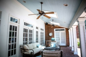 A Homes Sunlit covered patio with comfy furniture