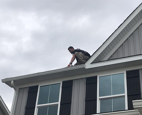 Home Inspector Arthur Duhaime from Clear Home Inspection inspecting a roof