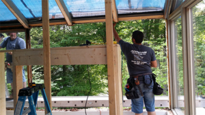 Crew of carpenters remodeling a sunroom