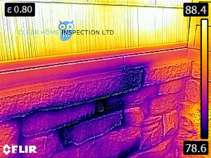 Infrared image of moisture intrusions at a homes stone veneer