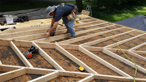 Sleeper rafters being installed by a carpentar