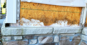 Water damage behind stone veneer on a new home in Louisville, OH