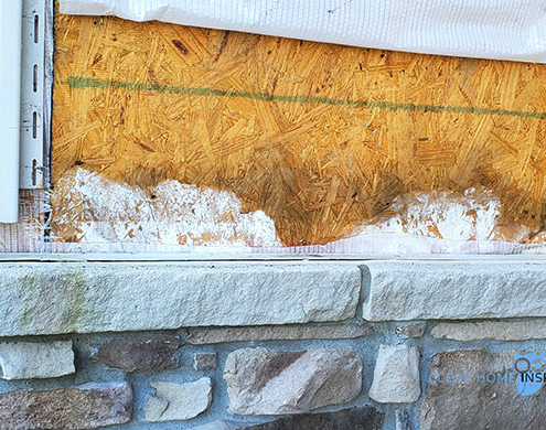 Water damage behind stone veneer on a new home in Louisville, OH